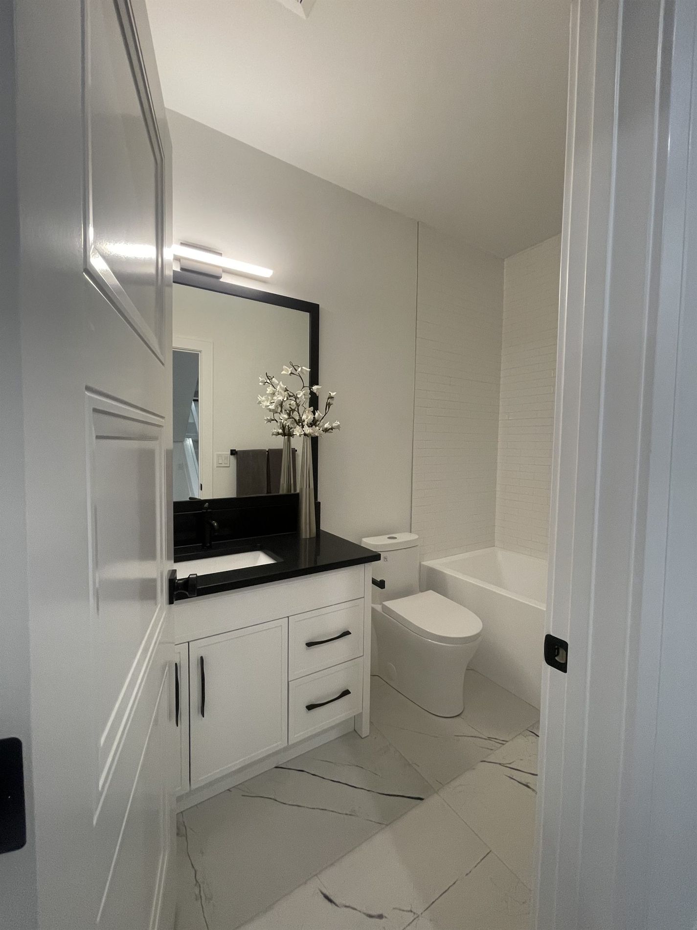 Powder room with a floating vanity